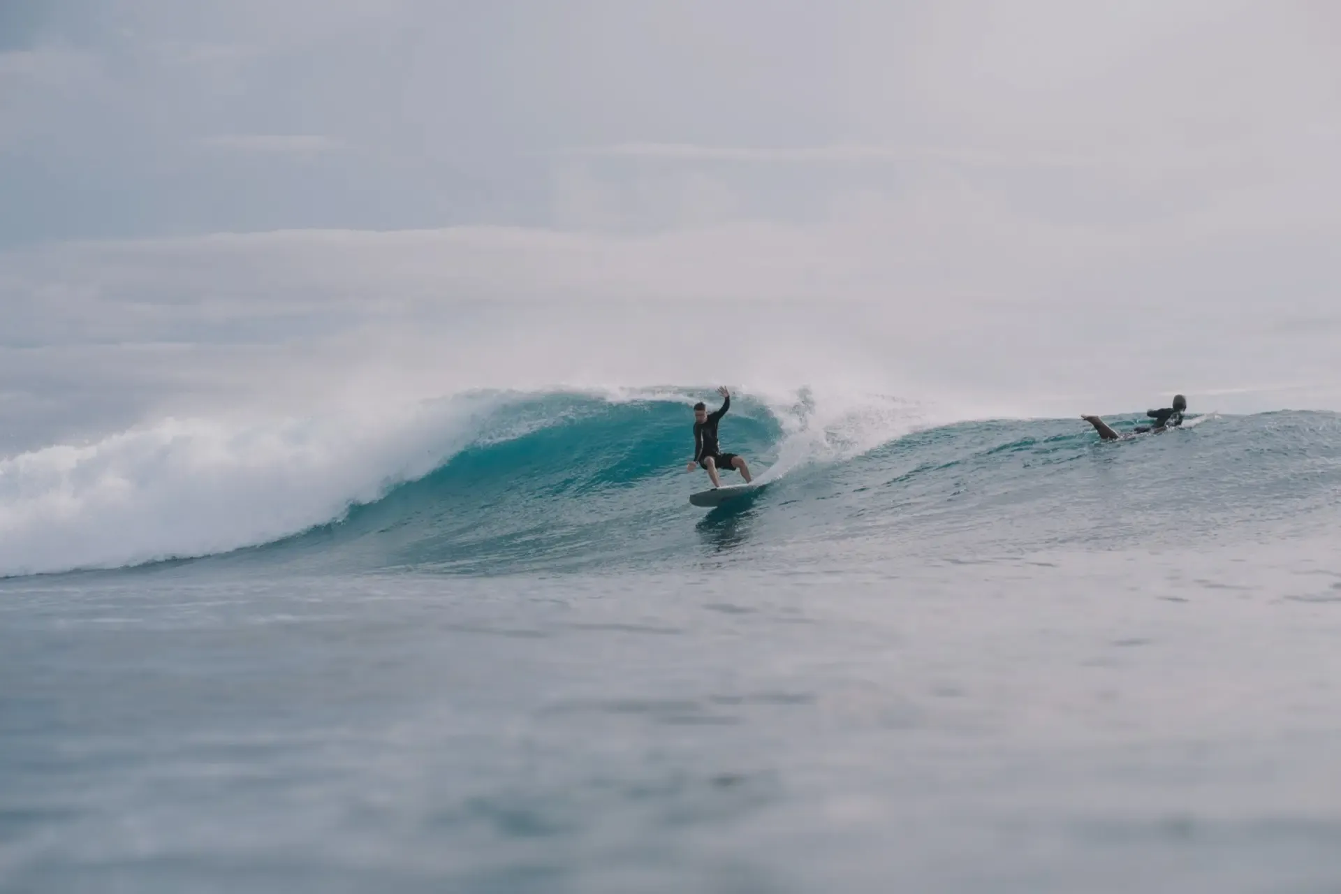 Surfer riding the long open face of the left-hand point break at Pavones