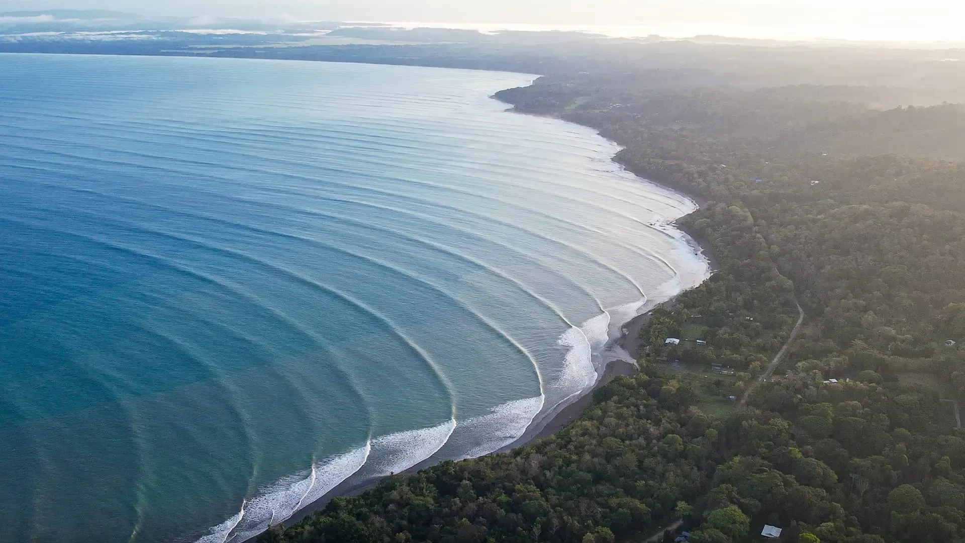Long left-hand wave peeling along the Pavones point break, southern Pacific coast of Costa Rica