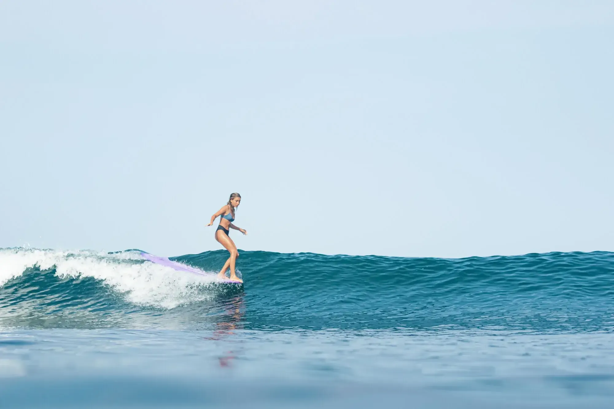A long left-hand wave breaking along the point at Pavones on Costa Rica's southern Pacific coast