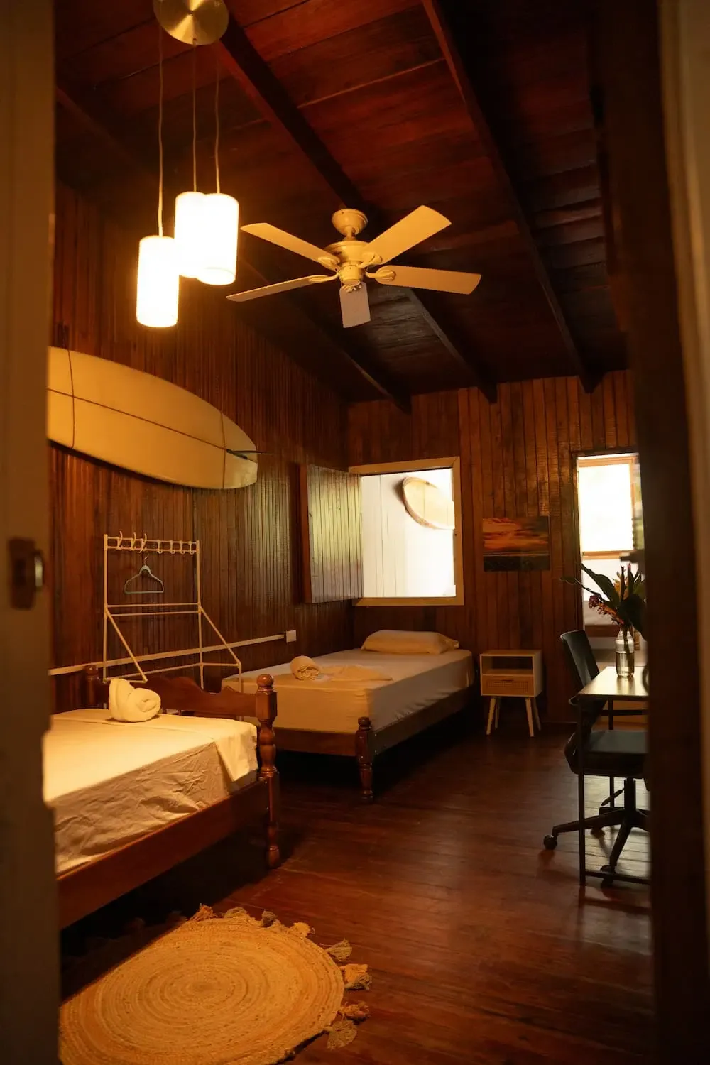 Clean twin room at Pavones Surf Camp with two single beds, simple and comfortable