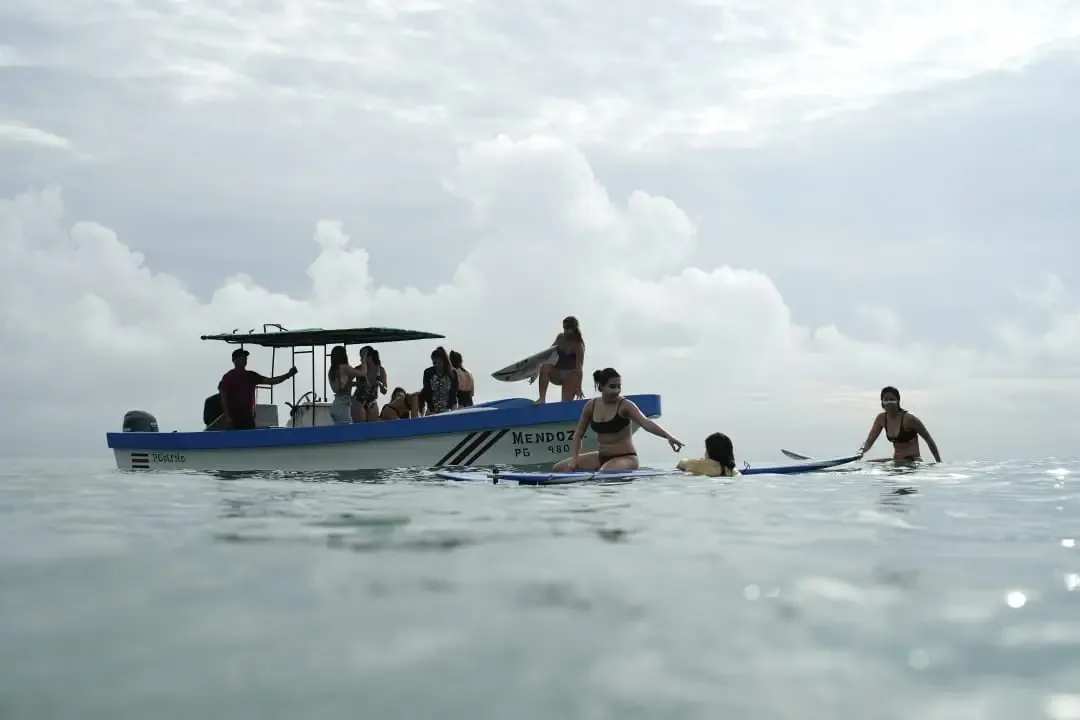Small boat crossing the calm Golfo Dulce toward the Matapalo surf breaks on the Osa Peninsula